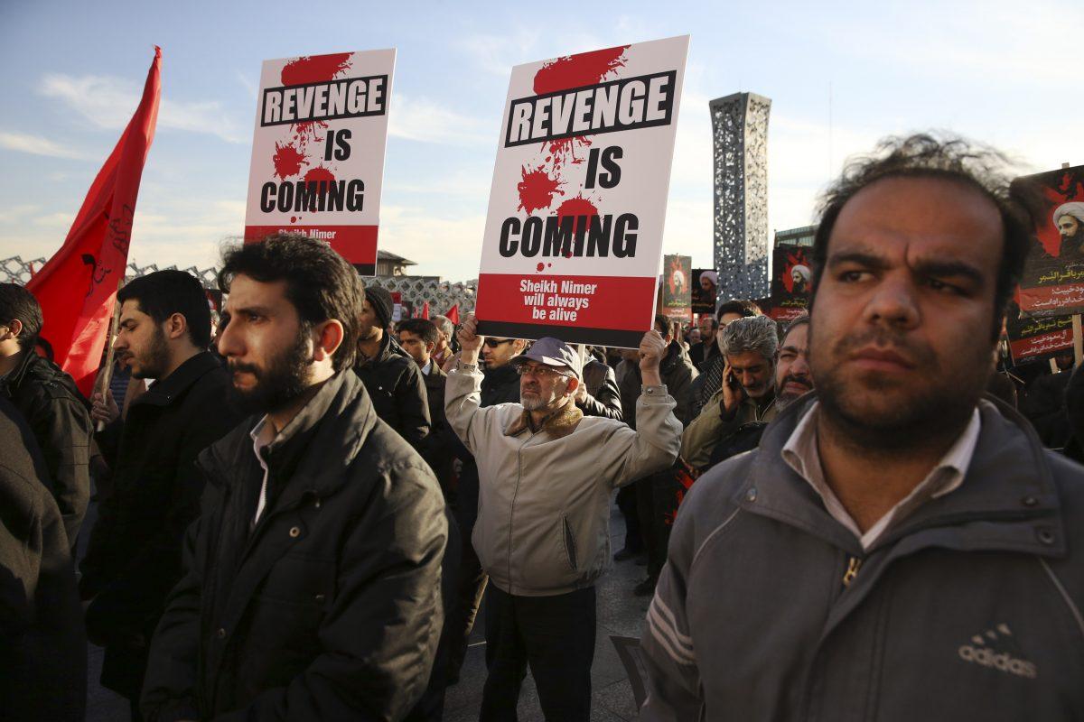 Iranian demonstrators protest the execution by Saudi Arabia of Sheikh Nimr al-Nimr, a prominent opposition Saudi Shi'ite cleric, by holding anti-Saudi placards at a rally in Tehran, Iran, on Jan. 4, 2016. (Vahid Salemi/AP Photo)