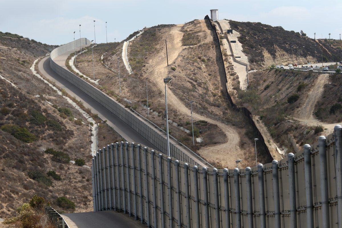Newer and older sections of the U.S.-Mexico border fence climb a hill, near San Diego, Calif., on Oct. 3, 2013. (John Moore/Getty Images)