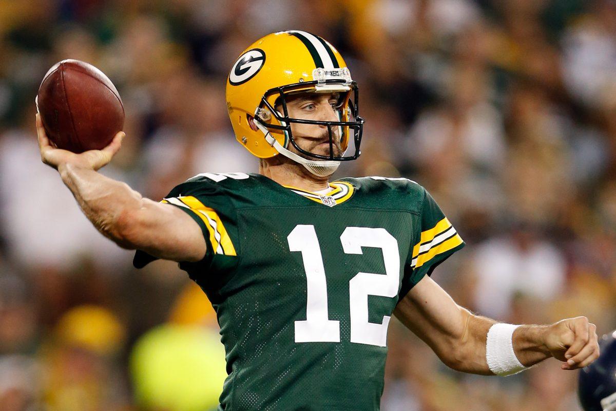 Aaron Rodgers and the Green Bay Packers have some unfinished playoff business to attend to after last year's late-game meltdown against in Seattle. (Christian Petersen/Getty Images)
