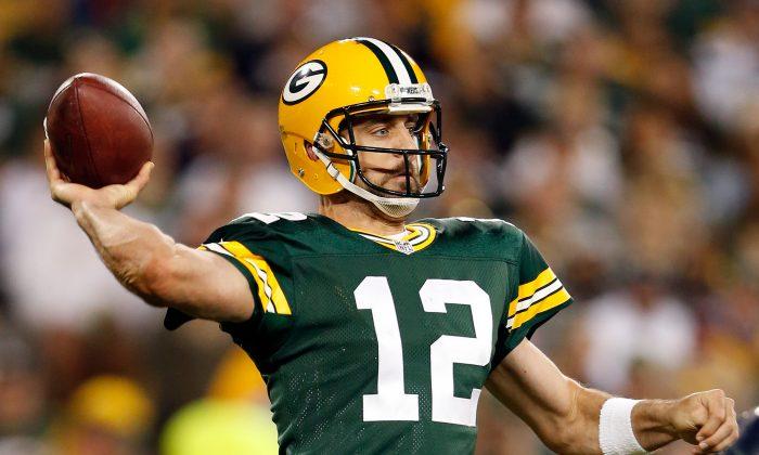 Aaron Rodgers Carted Off Field to Locker Room