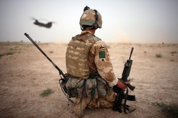 A British Army soldier from the 3rd Battalion, Parachute Regiment, secures the helicopter landing strip (HLS) during operation Southern Beast in Maywand District, Kandahar Province, Afghanistan, on Aug. 6, 2008. (Marco Di Lauro/Getty Images)