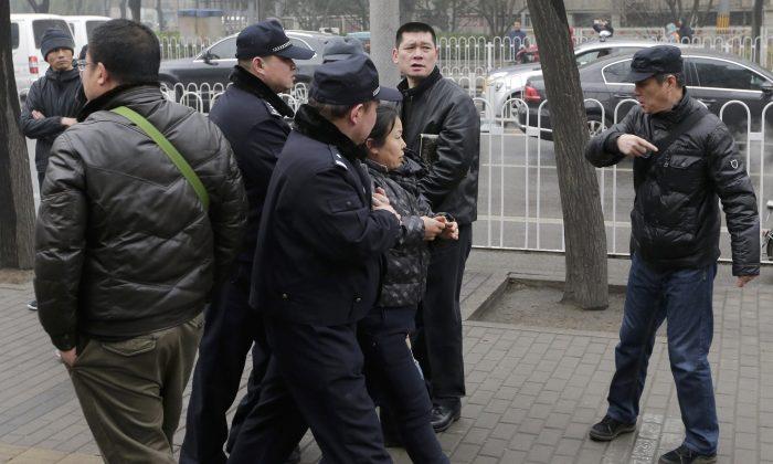 China Arrests Rights Lawyers 6 Months After Taking Them Away
