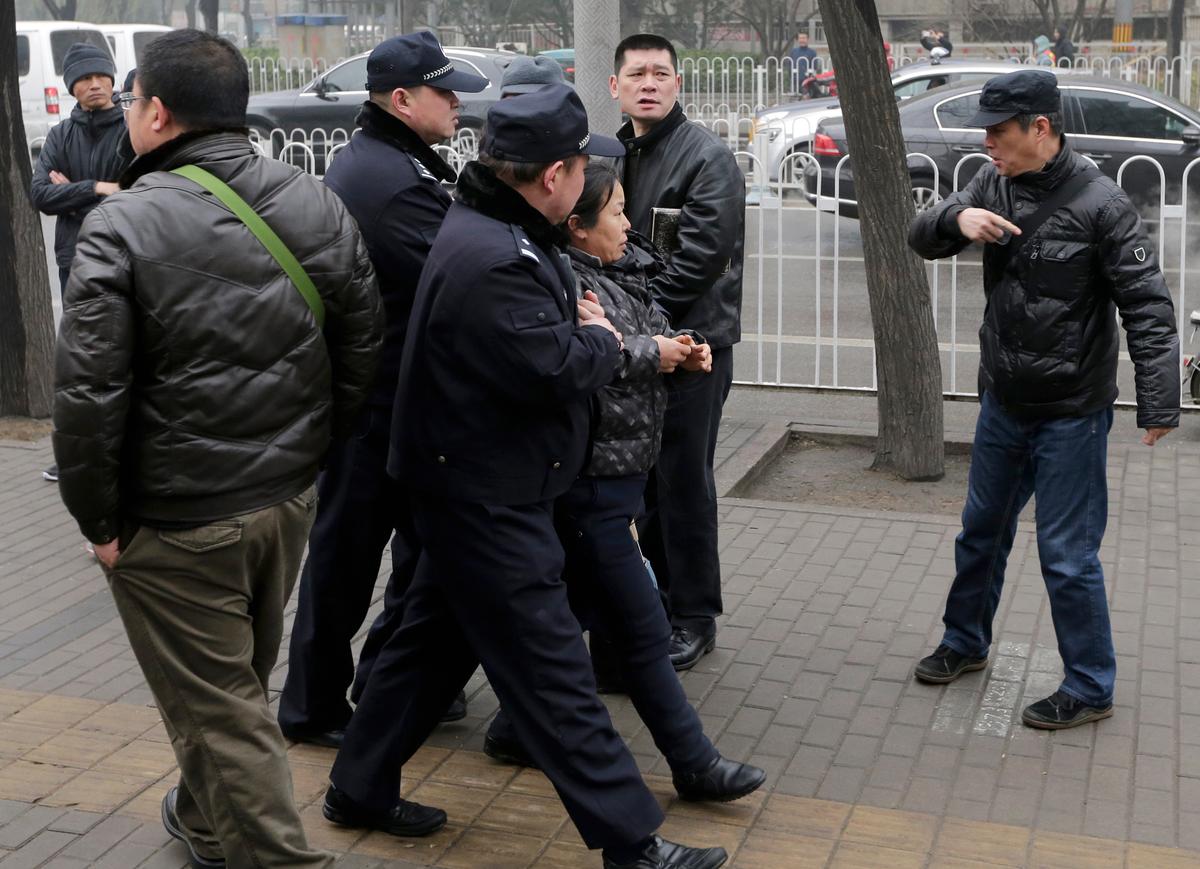 China Arrests Rights Lawyers 6 Months After Taking Them Away