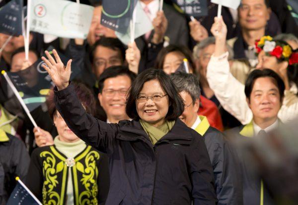 President-elect Tsai Ing-wen waves to supporters at her Democratic Progressive Party headquarter in Taipei, Taiwan on Jan. 16, 2016, as Taiwan's first female leader. (Ashley Pon/Getty Images)
