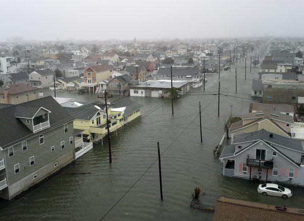 Coastal flooding from a winter snowstorm inundates houses along New York Avenue, in North Wildwood, N.J., on Jan. 23, 2016. (Robb Nunzio/AP Photo)