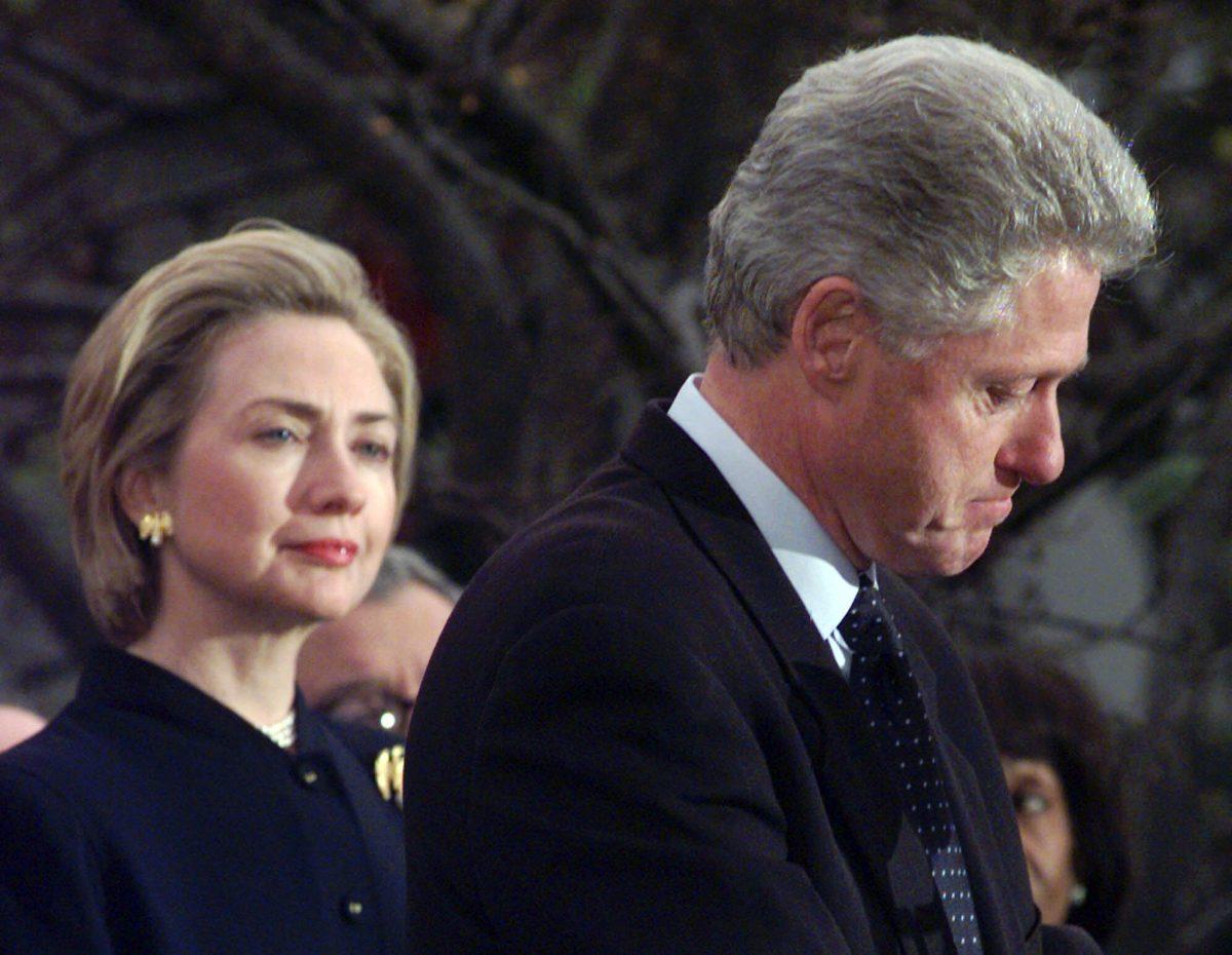 First lady Hillary Rodham Clinton watches President Clinton on Dec. 19, 1998, pause as he thanks those Democratic members of the House of Representatives who voted against impeachment. The long-running drama of Hillary Clinton's marriage—her husband's infidelity and how she dealt with it—is back as a subtext in this year's presidential race. (AP Photo/Susan Walsh)