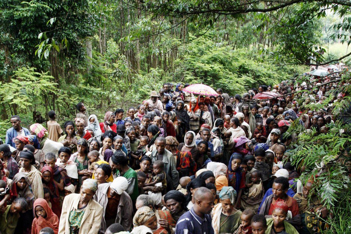 Ethiopians crowd a rural road as they queue up to be examined at a Medecins Sans Frontieres (Doctors Without Borders, MSF) outreach therapeutic programs (OTPs) center in Tunto, southern Ethiopia, on July 18, 2008. (Siegfried Modola/AFP/Getty Images)