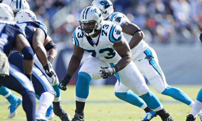 Panthers Tackle Michael Oher Posts Picture With Adoptive Parents on Field After Carolina Win