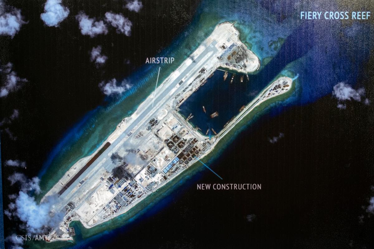 An island that China is building on the Fiery Cross Reef in the South China Sea. The Chinese regime is accusing the United States of "hegemony" for challenging its land-grab in the South China Sea. (Cliff Owen/AP)