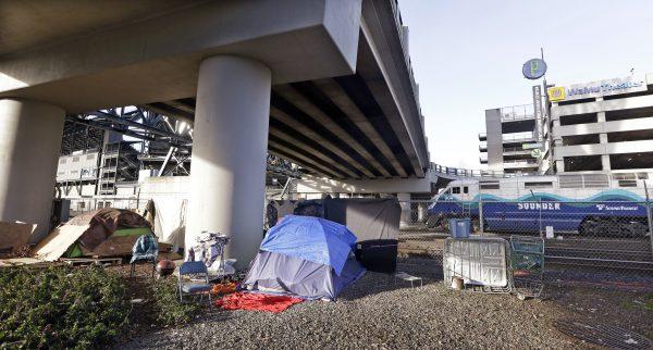 Tents sit under an overpass in view of sports stadiums near a Seattle homeless encampment in Seattle, Wash., on Feb. 2, 2016. (Elaine Thompson/AP Photo)
