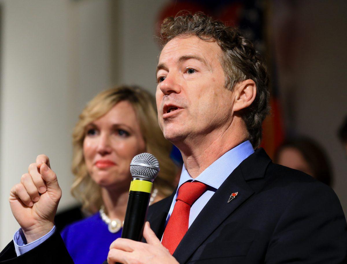 Sen. Rand Paul, R-Ky., speaks to supporters with his wife Kelley by his side, during a caucus night victory party at the Scottish Rite Consistory in Des Moines, Iowa, Feb 1, 2016. (AP Photo/Nati Harnik)