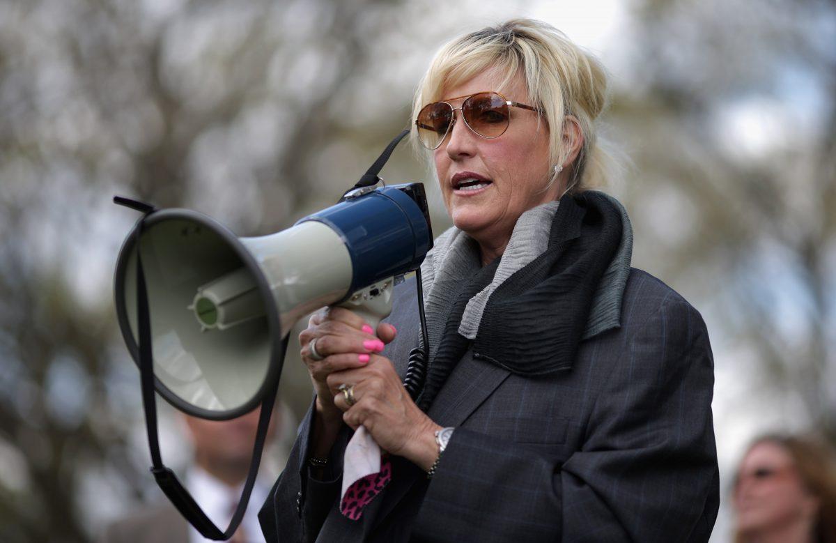 Consumer advocate Erin Brockovich addresses a rally against the federal government's support for what they say is a known polluter on Capitol Hill in Washington, D.C., on April 23, 2014. (Chip Somodevilla/Getty Images)