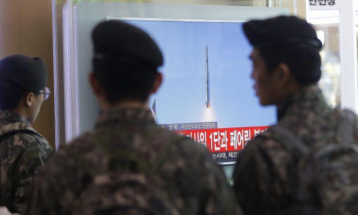 North Korea Praises Rocket; Others View as Covert Missile Test