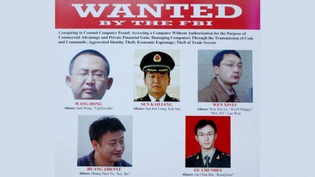 A wanted poster is displayed at the Justice Department in Washington on May 19, 2014, after U.S. authorities announced the indictment of five Chinese military hackers. The United States is considering economic sanctions to counter China's cybertheft. (AP Photo)