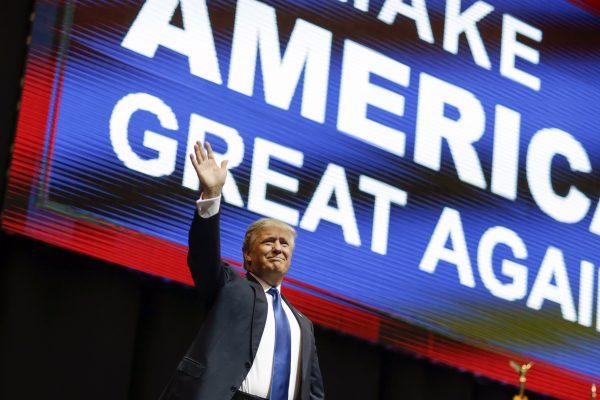 Republican presidential candidate, businessman Donald Trump waves as he arrives for a campaign rally in Manchester, N.H., on Feb. 8, 2016. (David Goldman/AP Photo)