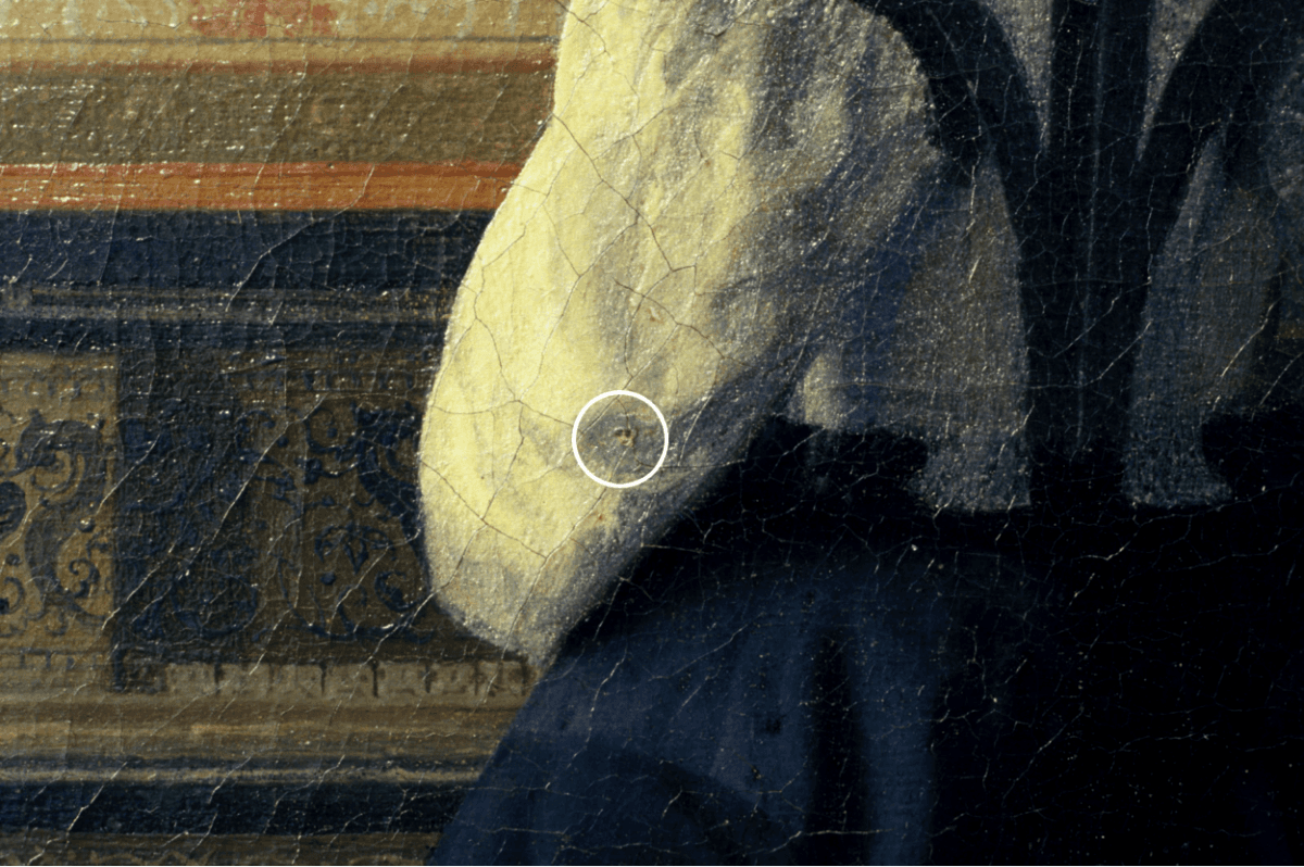 Detail showing the pinhole left in the painting "The Music Lesson" by Johannes Vermeer, circa 1662–1664. (Courtesy of Jorgen Wadum)