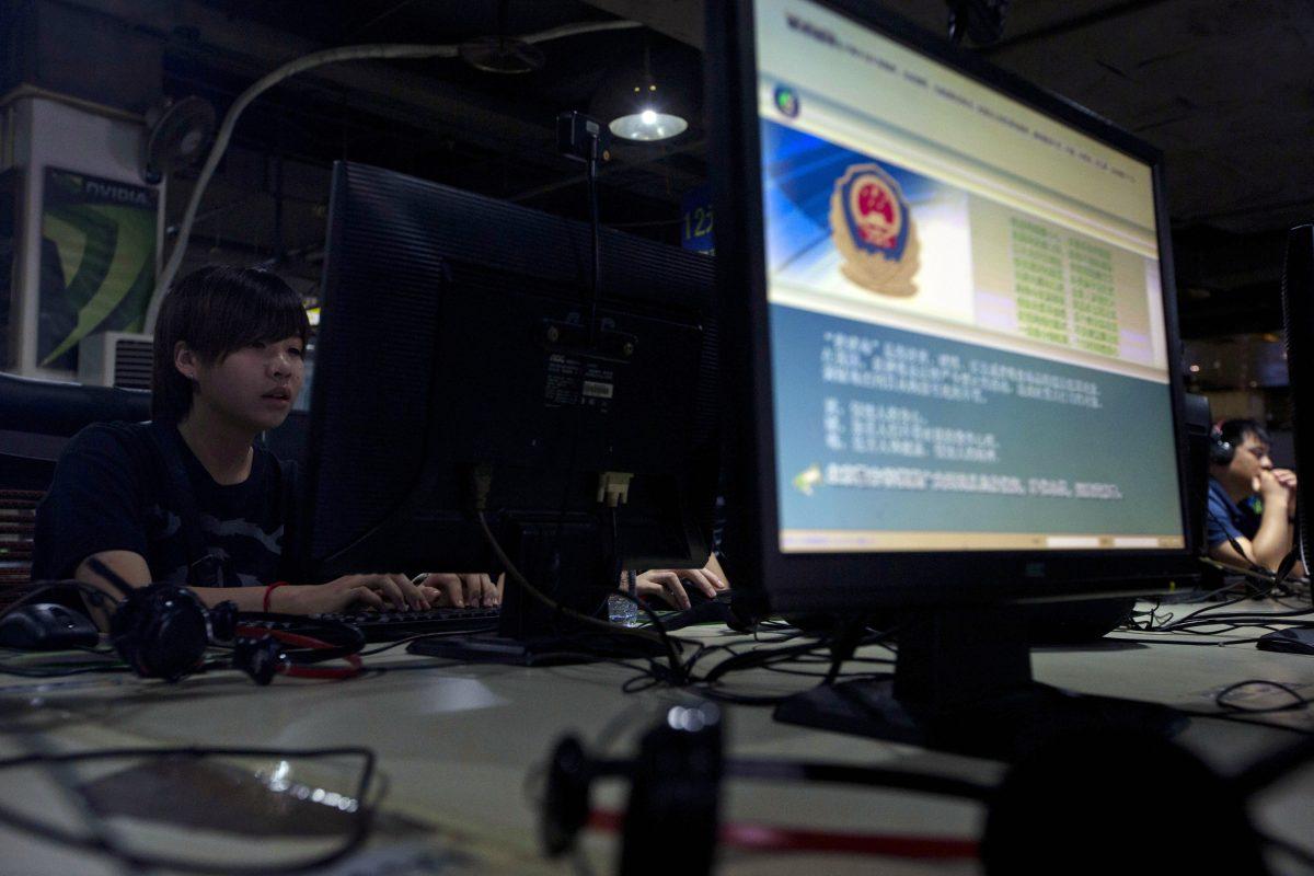 A computer displays a message from the Chinese Great Firewall on the proper use of the Internet at an Internet cafe in Beijing. New web publishing news announced last week will bar foreign companies from publishing most forms of online content. (Ng Han Guan, File/AP Photo)