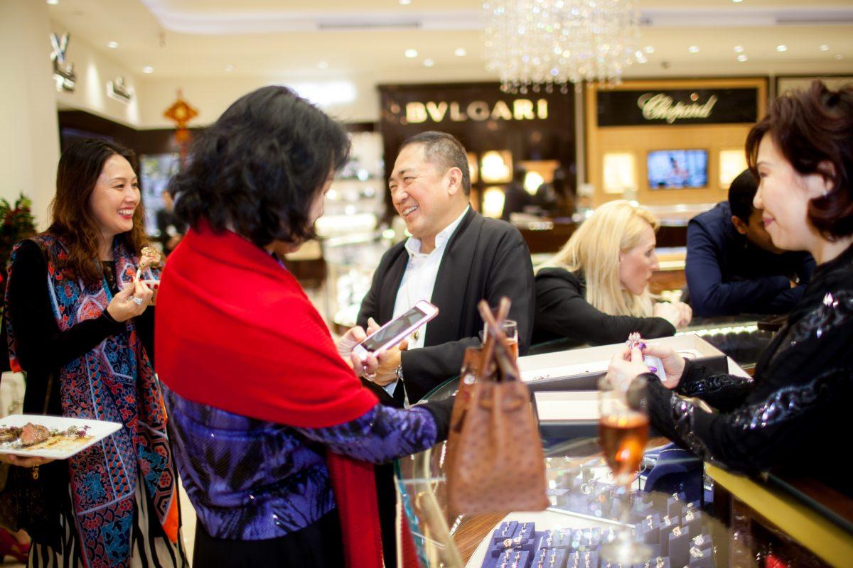 Customers chat with Qeelin co-founder Dennis Chan at the unveiling of Qeelin Collections and Chinese New Year Festivities at CH Premier Jewelers in the Westfield Shopping Center in Santa Clara, Calif., on Feb. 20. (Christian Lambert for Epoch Times)