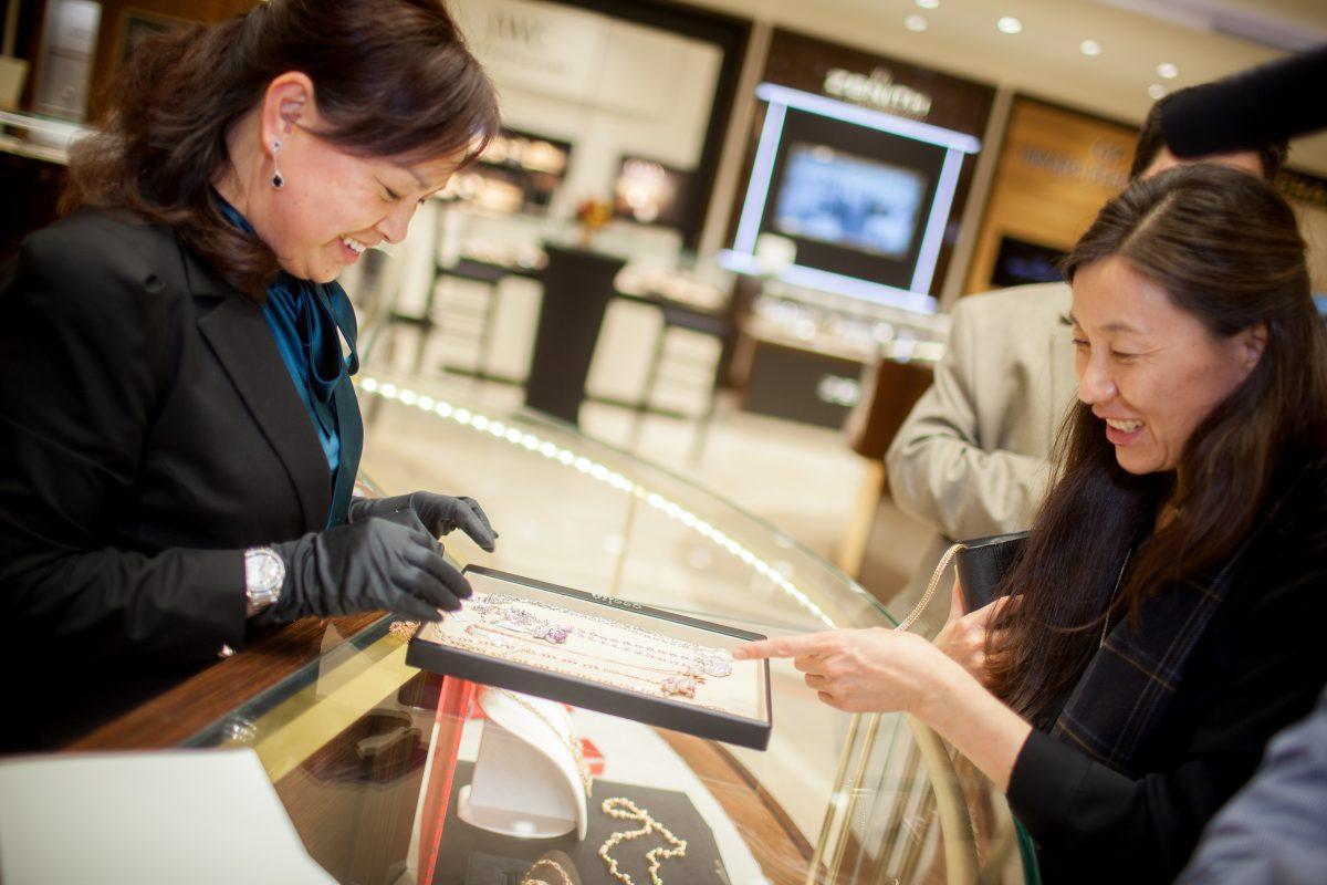 CH Premier staff shows several pieces of the Qeelin Collection to a customer during the unveiling of Qeelin Collections and Chinese New Year Festivities at CH Premier Jewelers in the Westfield Shopping Center in Santa Clara, Calif., on Feb. 20. (Christian Lambert for Epoch Times)