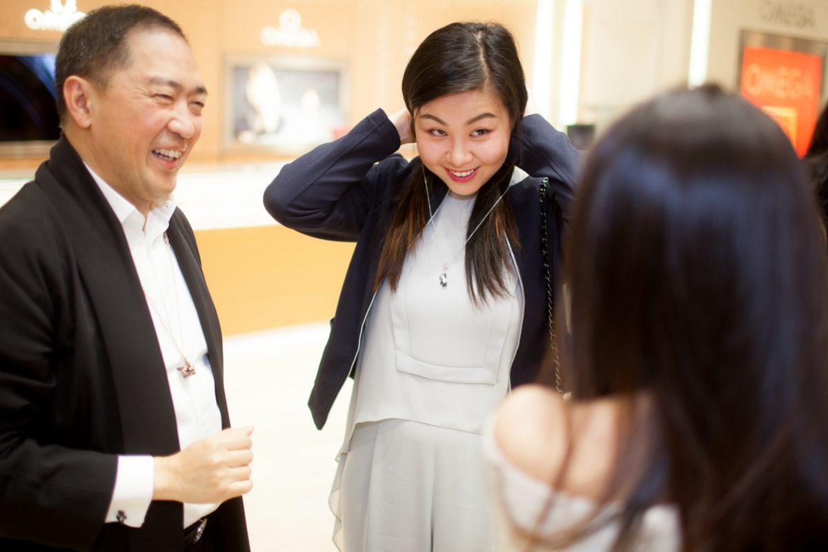 Qeelin co-founder Dennis Chan watches customers try on his jewelry during the unveiling of Qeelin Collections and Chinese New Year Festivities at CH Premier Jewelers in the Westfield Shopping Center in Santa Clara, Calif., on Feb. 20. (Christian Lambert for Epoch Times)