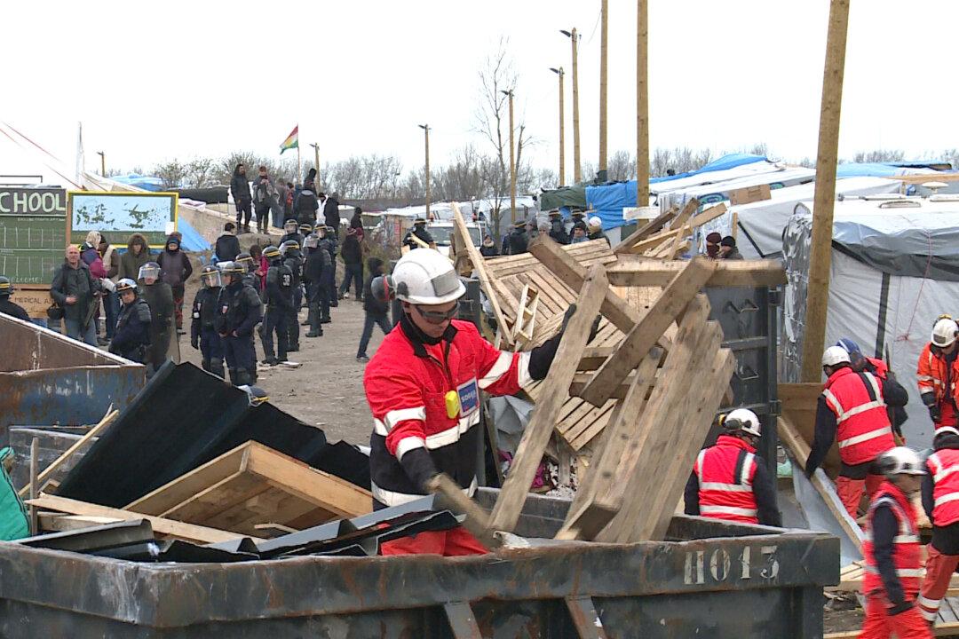 Police Oversee Dismantling of Giant Calais Migrant Camp