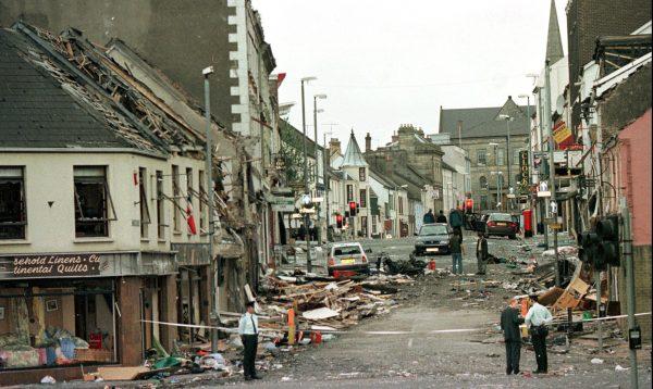 Royal Ulster Constabulary Police officers stand on Market Street, the scene of a car bombing in the centre of Omagh, Co Tyrone, 72 miles west of Belfast, Northern Ireland, on Aug. 15, 1998. (Paul McErlane/AP Photo)