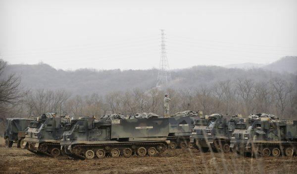A U.S. Army soldier stands on an armored vehicle during an annual exercise in Yeoncheon, near the border with North Korea, on March 7, 2016. (Ahn Young-joon/AP Photo)