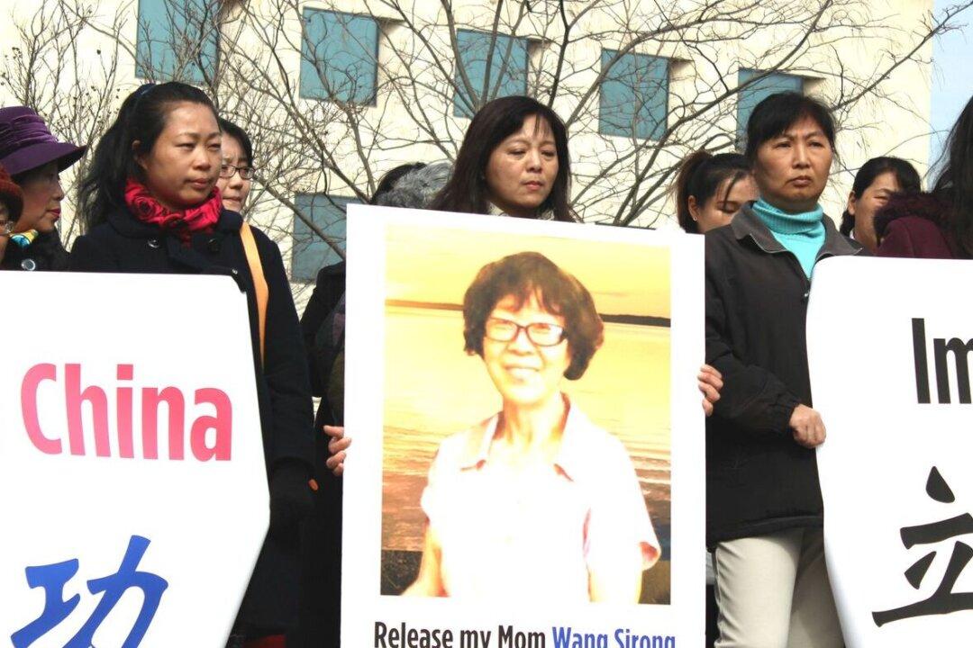 Banner With Festive Message Leads to Lock Up of 65-Year-Old Chinese Woman