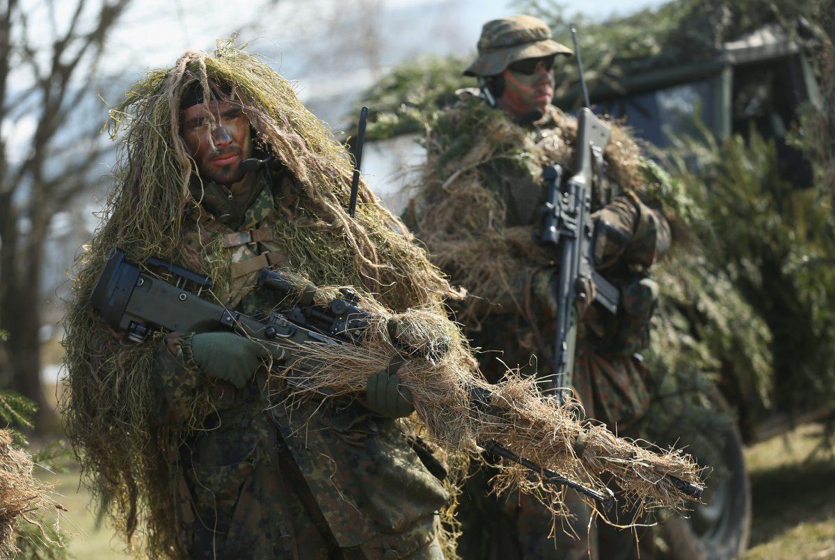 Members of the German Bundeswehr's 371st Armored Infantry Battalion (Panzergredanadierbataillon 371) stand in camouflage with sniper rifles during a media event at the battalion's base on March 10, 2015 in Marienberg, Germany. The 371st is among units that will participate in the new NATO Very High Readiness Joint Task Force (VJTF), an ultra-fast reaction force that will be able to deploy within a five-day period. (Sean Gallup/Getty Images)