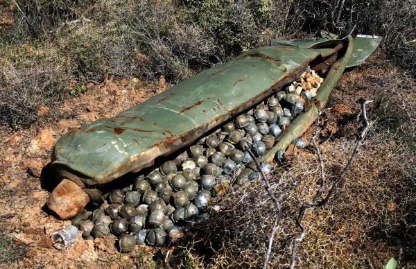 A cluster bomb unit containing more than 600 cluster bombs that was dropped by Israeli warplanes during the 34-day-long Hezbollah-Israeli war sits in a field in the southern village of Ouazaiyeh, Lebanon, on Nov. 9, 2006. (AP Photo/Mohammed Zaatari)