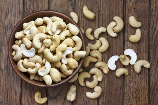 In only two handfuls of cashews, there are 2000 mg of tryptophan. (etiennevoss/iStock)