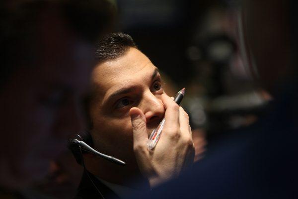 A trader on the floor of the New York Stock Exchange moments after the crash in New York, on Oct. 13, 2008. While most people suffer from asset price crashes, bears profit in different ways. (Spencer Platt/Getty Images)