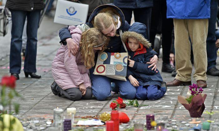 Brussels Mourns, Belgium on Alert as Police Hunt Suspect