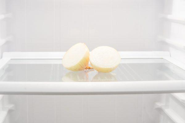 Cut onion in the refrigerator (Shamaan/Shutterstock)