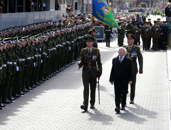 Irish President Michael D. Higgins (R) prepares to lay a wreath at the General Post Office on O'Connell Street, Dublin, Ireland, on March 27, 2016. (AP Photo/Peter Morrison)