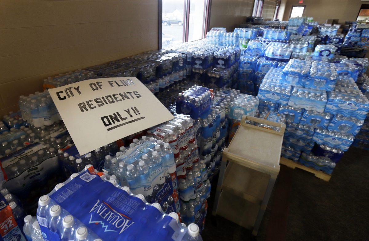 Hundreds of cases of bottled water are stored at Our Lady of Guadalupe Church in Flint, Mich., on Feb 5. (AP Photo/Carlos Osorio, File)