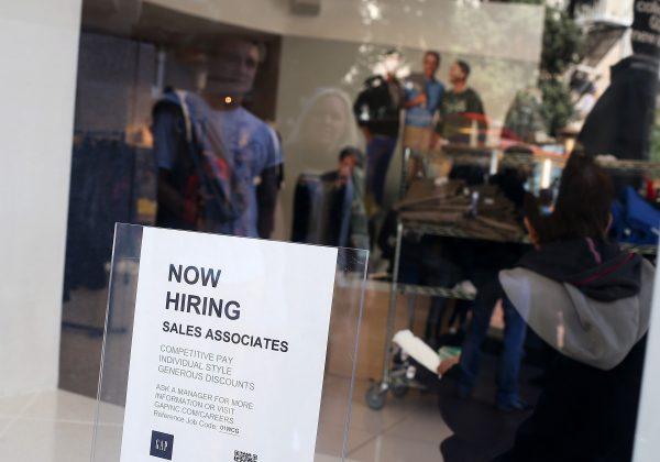 A "now hiring" sign is posted in the window of a GAP store in San Francisco, Calif., on Sept. 27, 2012. (Justin Sullivan/Getty Images)