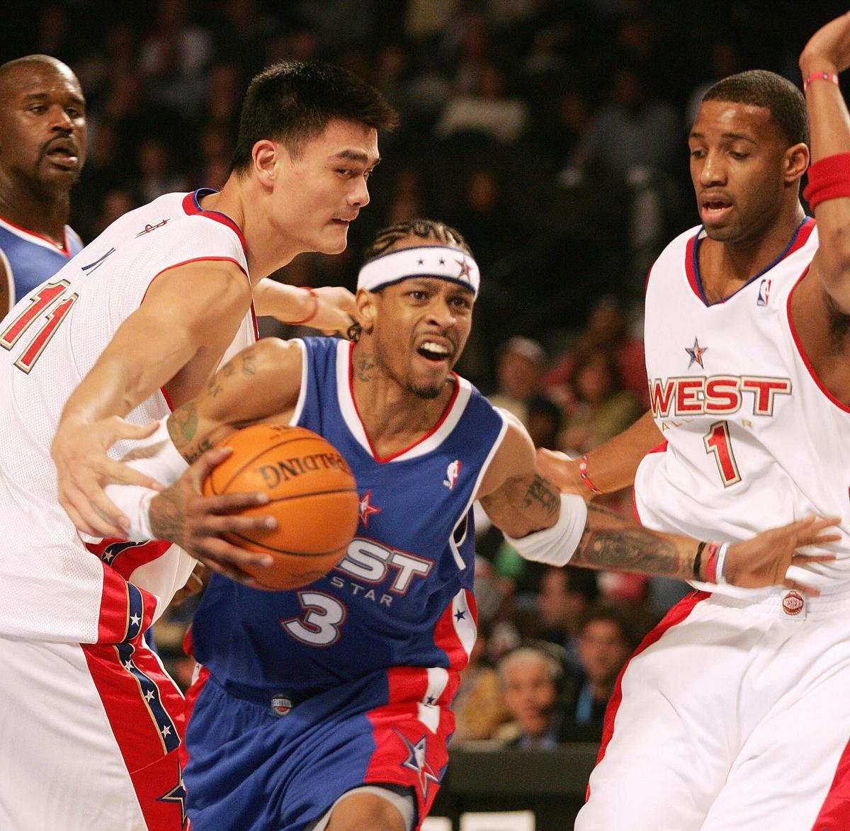 China's Yao Ming (L) of the Western Conference team defends against Allen Iverson (C) of the Eastern Conference as the West's Tracy McGrady (R) and the East's Shaquille O'Neal (far L) look on during the NBA All-Star game in Denver, Colorado on Feb. 20, 2005. Iverson was named Most Valuable Player (MVP) of the game as the East won 125-115. (Don Emmert/AFP/Getty Images)