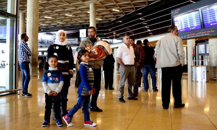 First Syrians Leave for US Under Surge Resettlement Program