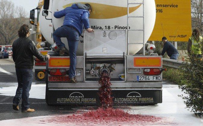 France Wages Wine-War on Spain; Dumps Roughly 90,000 Bottles of Spanish Wine Into Streets