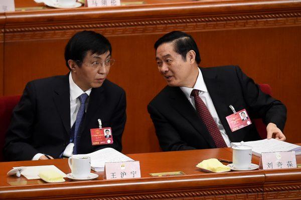 Wang Huning (L) speaks with Politburo member Liu Qibao (R) in the Great Hall of the People in Beijing, China, on March 5, 2016. (Wang Zhao/AFP/Getty Images)