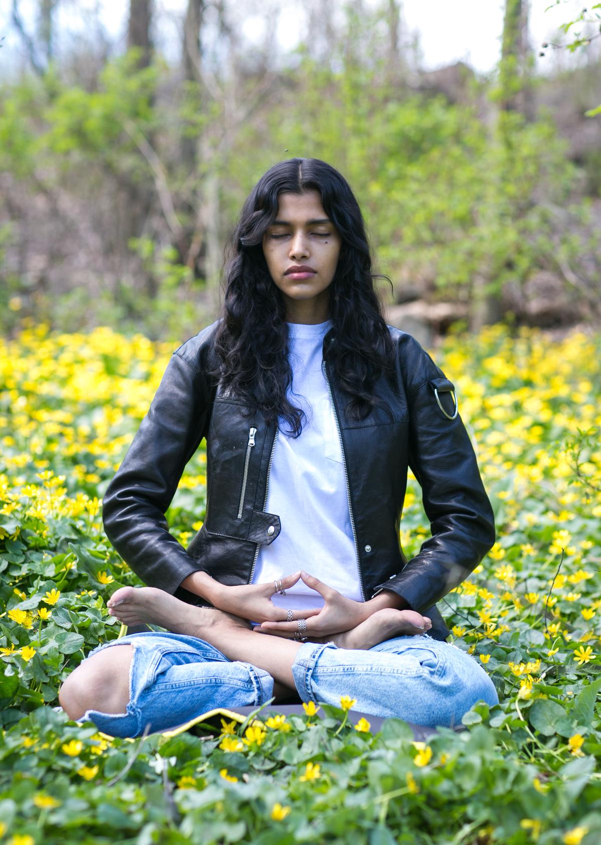 Fashion model Pooja Mor meditates in Central Park on April 19, 2016. (Benjamin Chasteen/The Epoch Times)