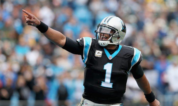 Cam Newton: Carolina Panthers Quarterback Hops Fence to Play Football With 7th Graders