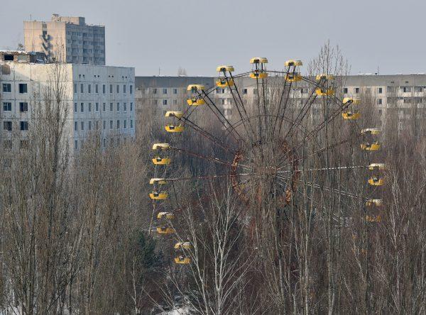 A photo taken on Jan. 22, 2016, shows a Ferris wheel between abandoned buildings in the ghost city Pripyat near to Chernobyl Power Plant. (Genya Savilov/AFP/Getty Images)