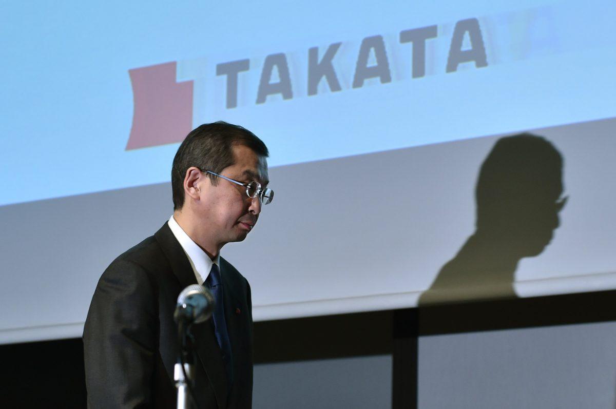 Japanese parts supplier Takata Corp Chairman and President Shigehisa Takada leaves after a press conference in Tokyo on Nov. 4, 2015. (Kazuhiro Nogi/AFP/Getty Images)
