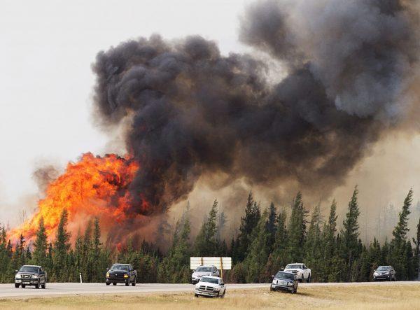 A wildfire burns south of Fort McMurray, Alberta, near Highway 63 on May 7, 2016. (Ryan Remiorz/The Canadian Press via AP)