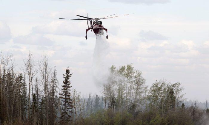 Cooler Temperatures, Rain Give Firefighters Hope in Canada