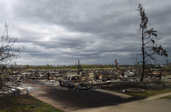 Burned out buildings are viewed in Fort McMurray, Alberta, during a media tour of the fire-damaged city on May 9, 2016. (Ryan Remiorz/The Canadian Press via AP)