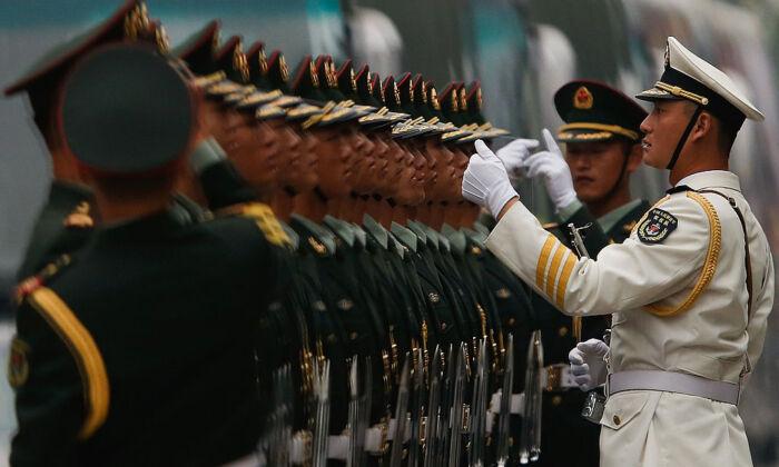 New Orders Tighten China’s Grip on Military Hackers