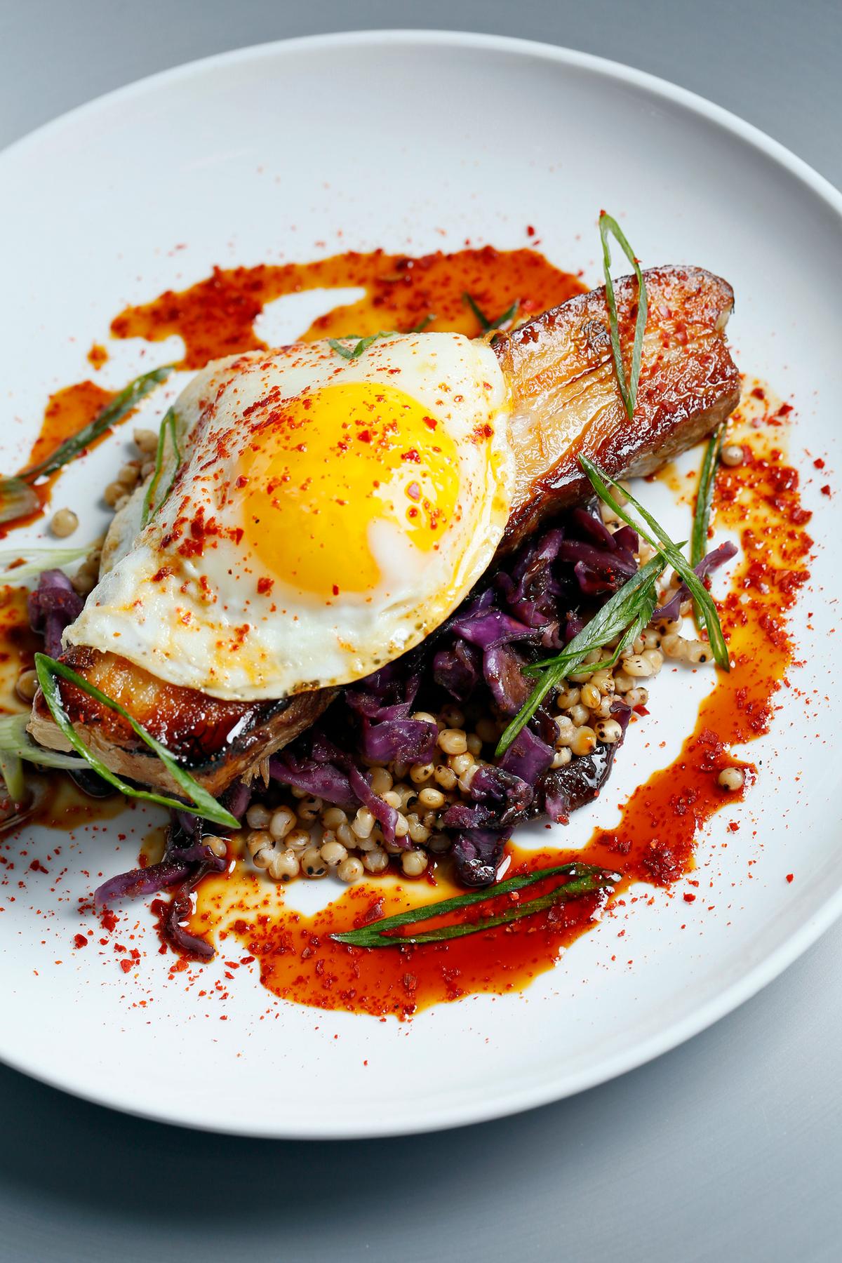 Tinker Street’s Pork Belly with kimchee, forbidden rice, sorghum glaze, and farm egg. (Courtesy of Tinker Street)
